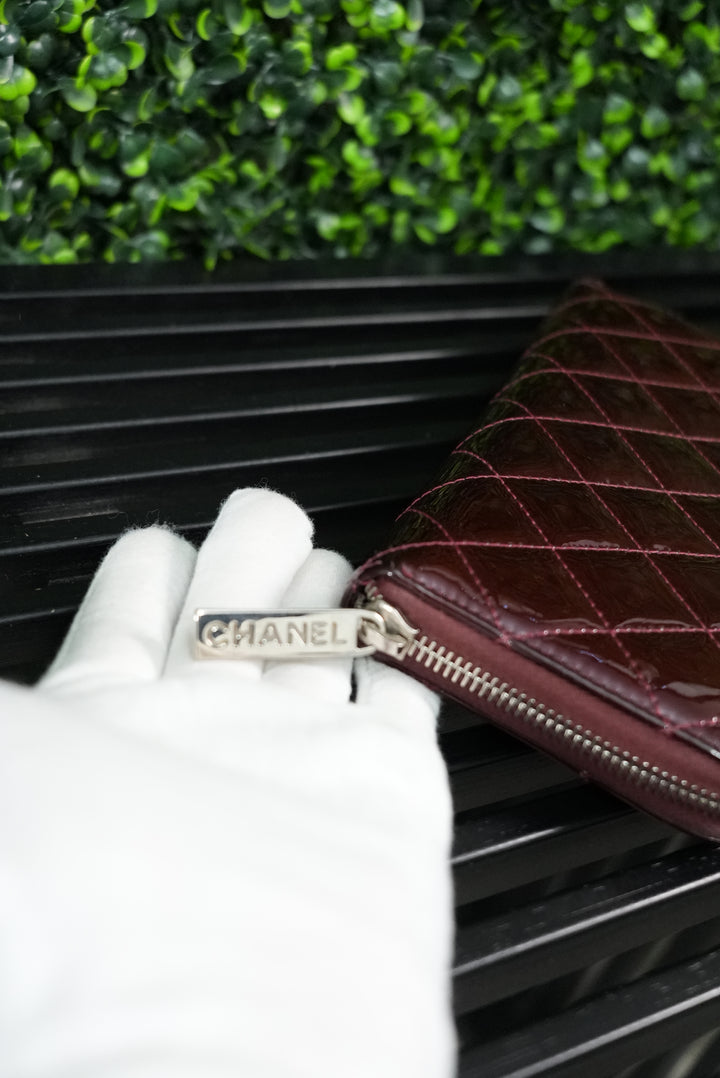 Chanel Burgundy quilted patent zippy